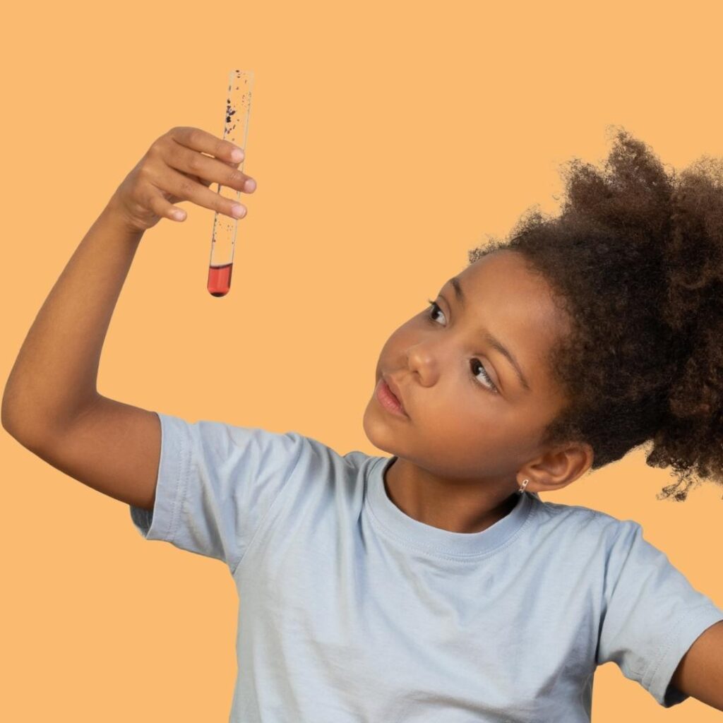 child looking at test tube science experiment