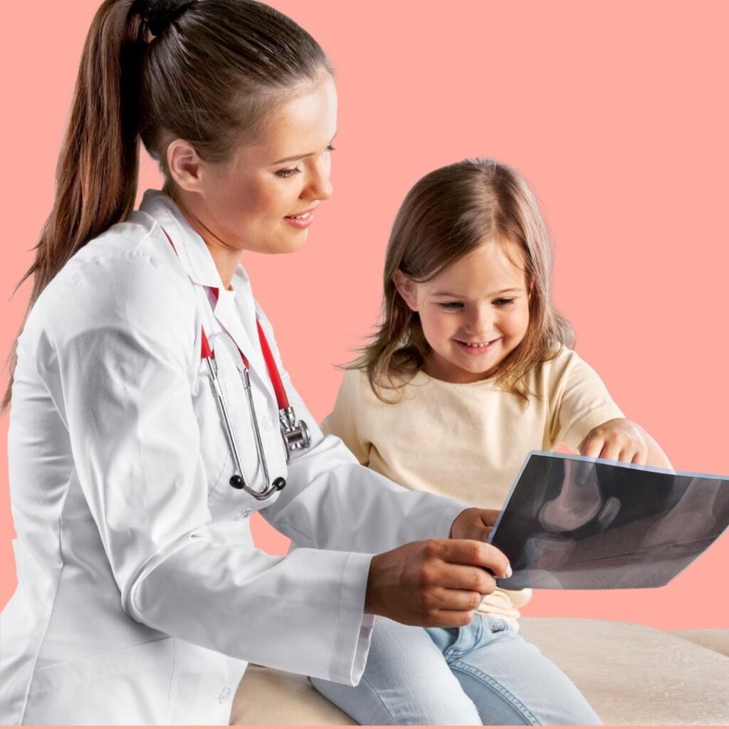 female doctor and child looking at x-ray
